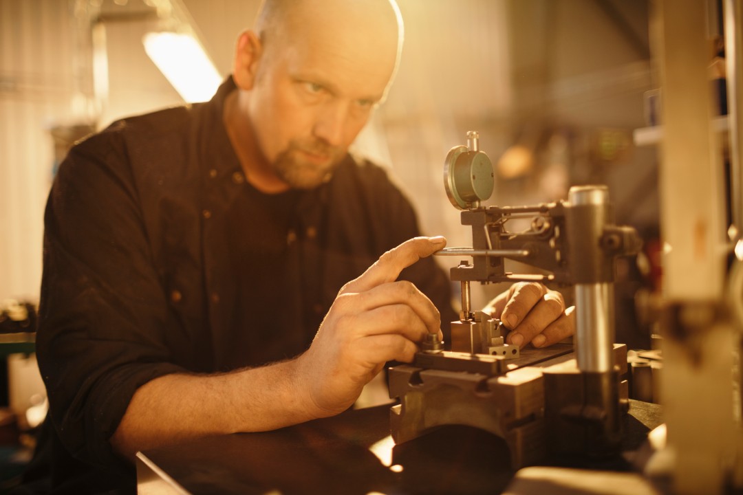 Machinist Checking Workpiece for Accuracy