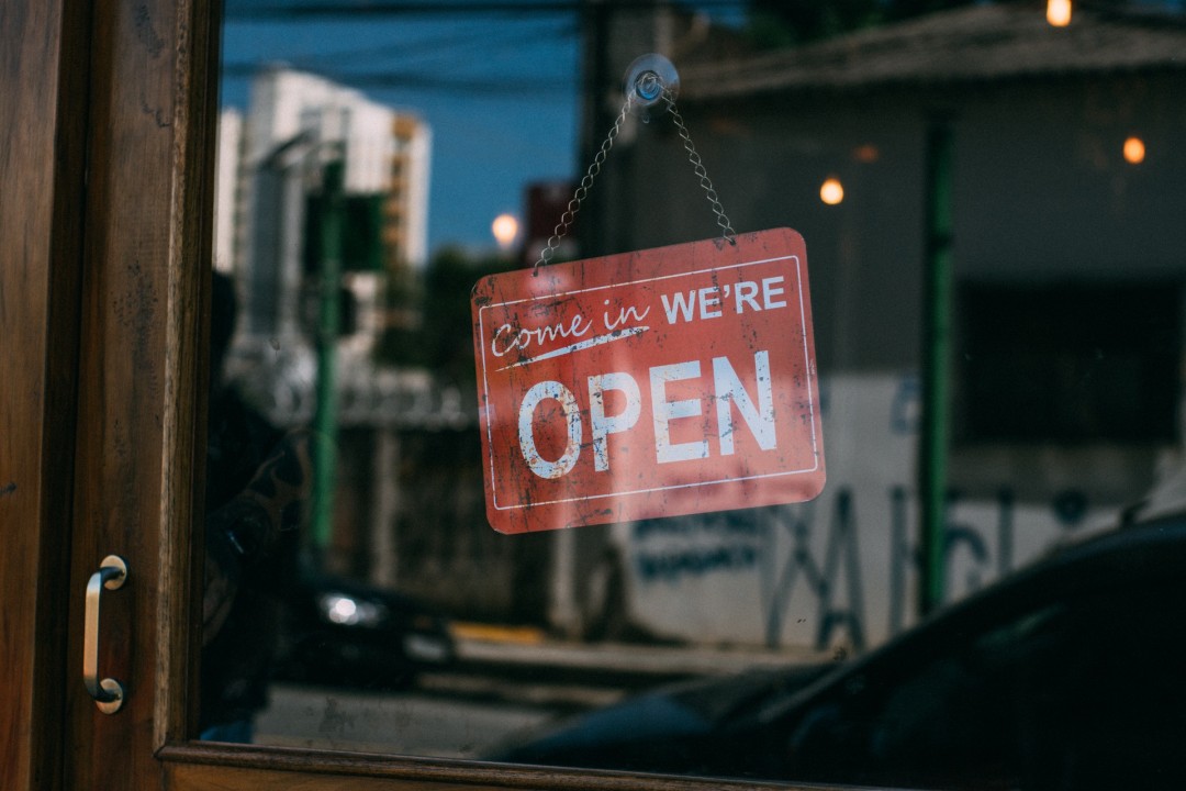 Come in We're Open sign on local small business