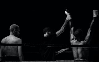 Arms raised of a boxer in victory